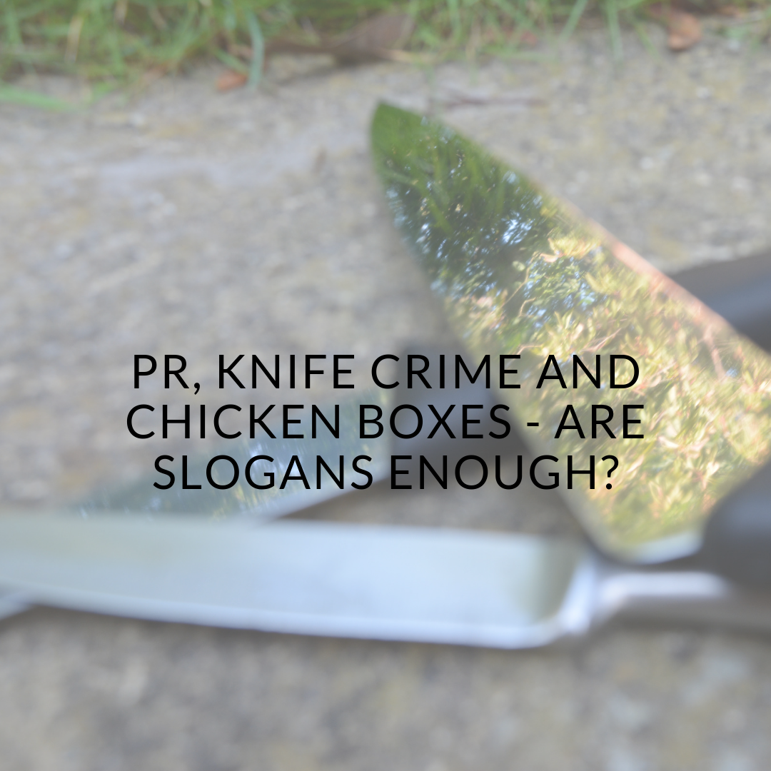 three kitchen knives on concrete